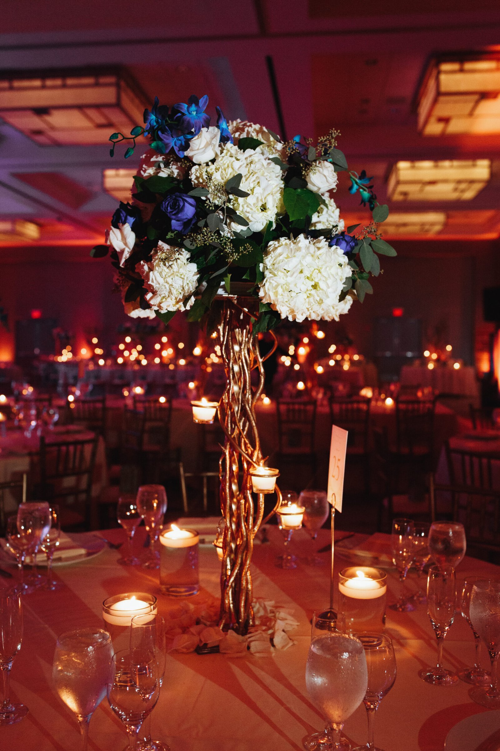 Tender hydrangea centerpiece on the round table with lightening candles